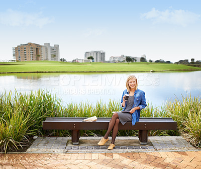Buy stock photo Woman, relax and portrait in park with coffee, book and happy with lunch on bench outdoor in Russia. Girl, smile and sitting at lake with espresso, latte and enjoy break from studying at college