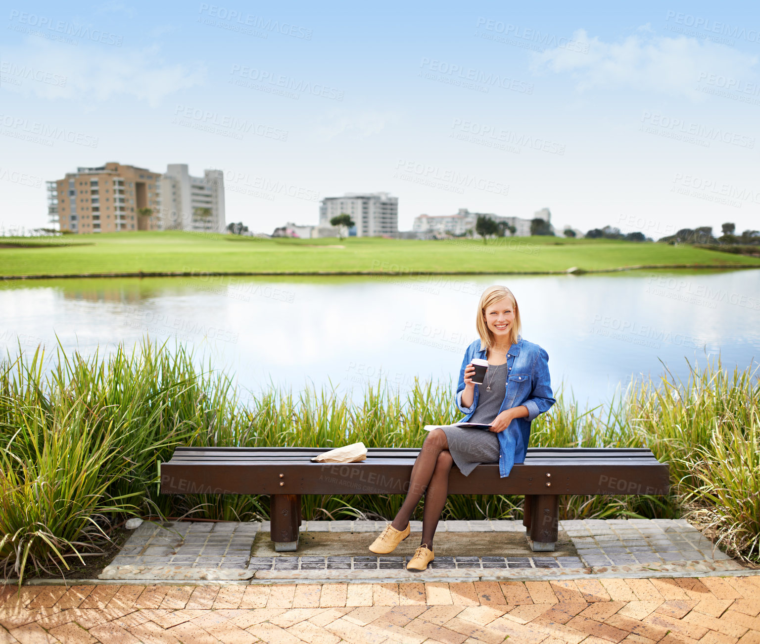 Buy stock photo Woman, relax and portrait in park with coffee, book and happy with lunch on bench outdoor in Russia. Girl, smile and sitting at lake with espresso, latte and enjoy break from studying at college