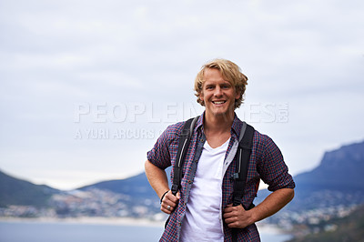 Buy stock photo Man, hiking and portrait on mountains for travel, adventure and wellness by ocean, sea and island in Europe. Face of an excited and young person with backpack for trekking, explore or outdoor journey