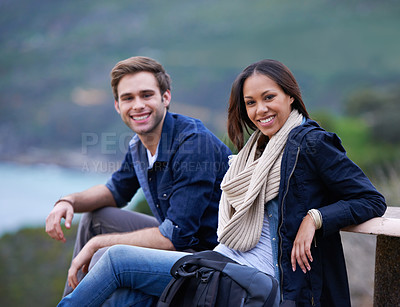 Buy stock photo Couple, relax and portrait in nature for outdoor date and adventure in winter on valentines day. Excited, interracial people with backpack on bench for hiking, trekking or travel break on mountains