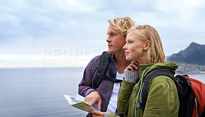 Buy stock photo Couple, thinking and map by ocean for hiking, direction or location on outdoor adventure together in nature. Young man and woman reading tour or travel guide for route, path or destination on hike
