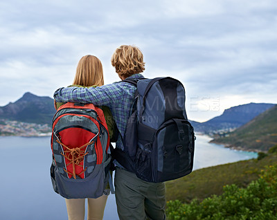 Buy stock photo Hiking, nature and back of couple on mountain with backpack for freedom, trekking and explore landscape. Travel, dating and man and woman hug by scenic view on holiday, vacation and outdoor adventure