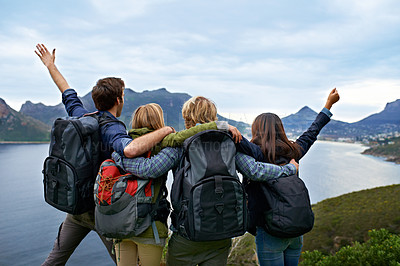 Buy stock photo A group of young people admiring the view together