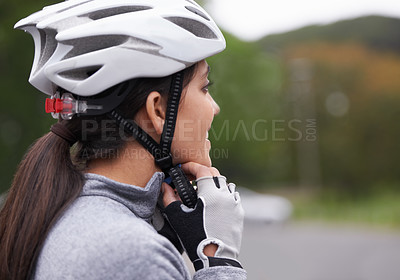 Buy stock photo Cycling, woman and fasten helmet for safety, protection and exercise gear to travel outdoor. Bicyclist, person and putting on hat in preparation for training, sports or closeup for fitness in profile