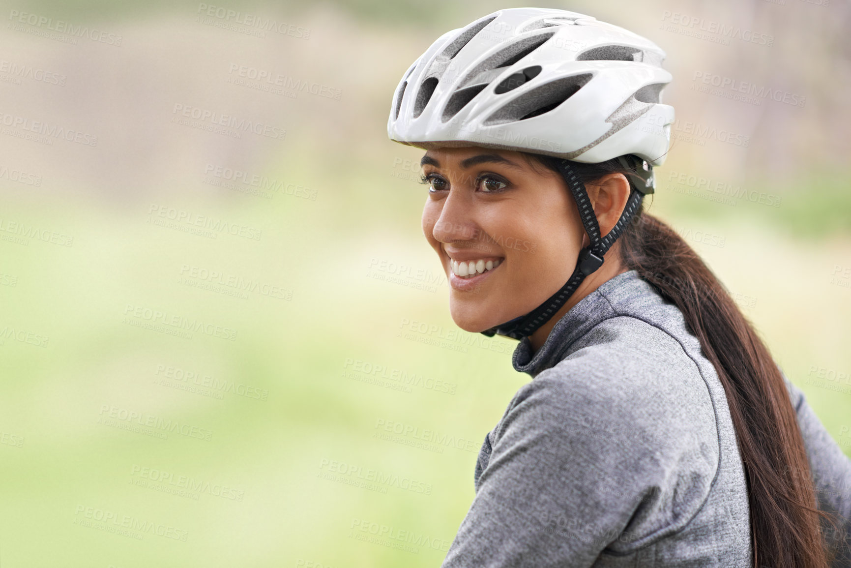 Buy stock photo Smile, cycling and woman in nature, thinking or dream on mockup space outdoor to exercise for fitness. Bicyclist, helmet and happy person travel on journey, adventure or workout for sports in summer