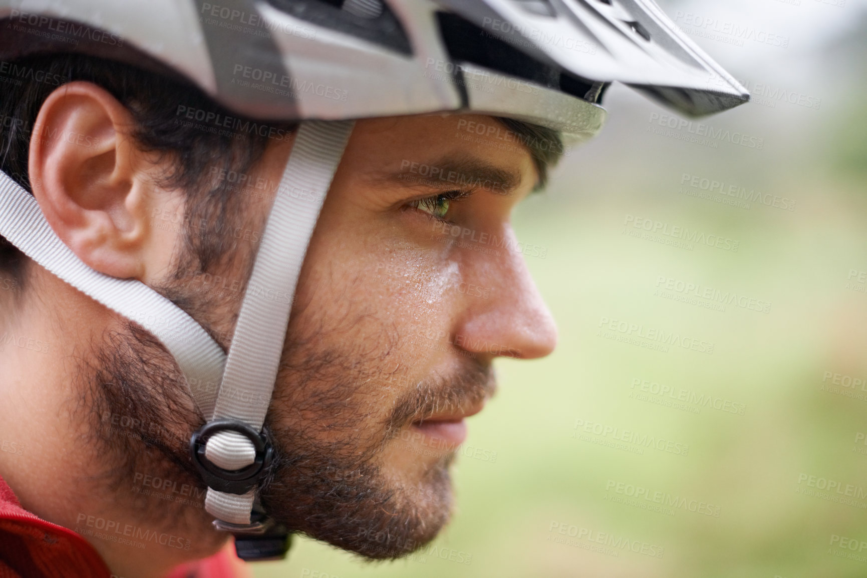 Buy stock photo Closeup profile of a cyclist wearing a helmet