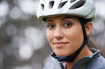 Buy stock photo Portrait, cycling and helmet with sports woman closeup on blurred background in nature for fitness. Face, exercise and safety with happy young sports athlete or cyclist in countryside for training