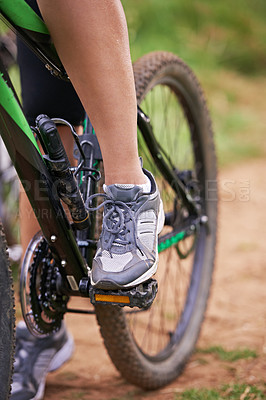 Buy stock photo Cycling, legs and person on bicycle outdoor for exercise, workout or fitness for sports. Mountain bIke, rider and shoes of bicyclist in nature to travel on transport, journey or closeup of adventure