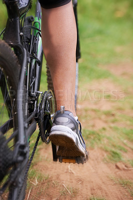 Buy stock photo Cycling, legs and person on fast bicycle outdoor for exercise, workout or fitness for sports. Mountain bIke, speed and shoes of bicyclist in nature to travel on transport, journey or closeup of back