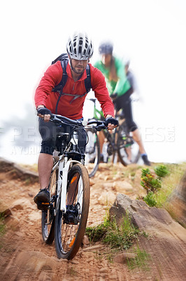 Buy stock photo Man, bicycle and cycling on dirt road for fitness, extreme sports or cardio exercise in nature. Male person, athlete or cyclist riding bike on rocky path, trail or outdoor slope with motion blur