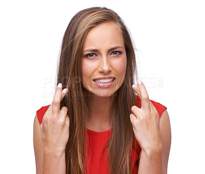 Buy stock photo Nervous, hope and portrait of a woman with fingers crossed on an isolated white background. Hopeful, expression and anxious girl with hand gesture for expressing wishing on a studio background