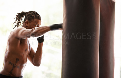 Buy stock photo Workout, punching bag and black man boxing in gym for exercise, sports challenge or competition training. Power, muscle and champion boxer at workout with confidence, fight and energy in fitness club