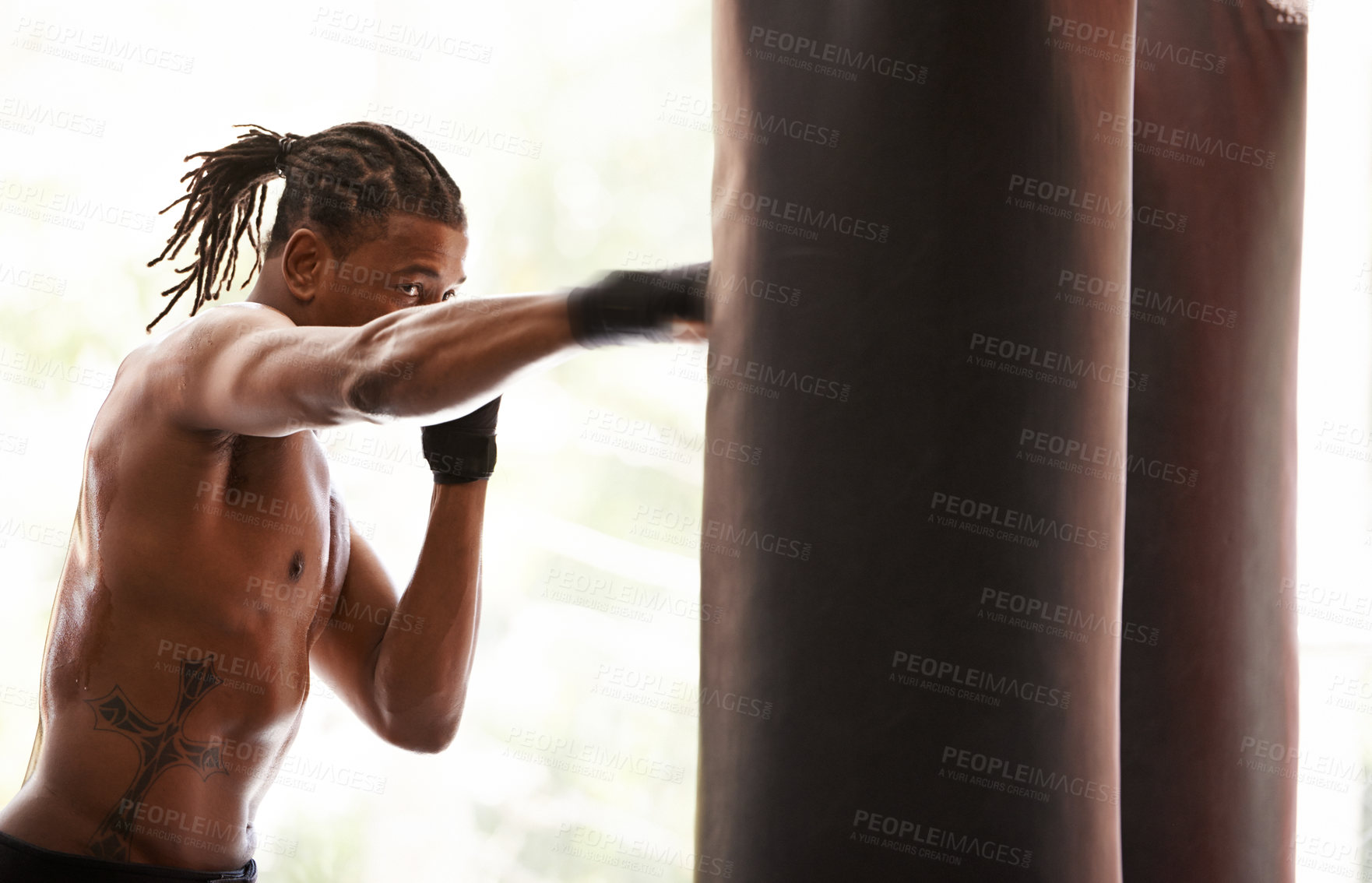 Buy stock photo Workout, punching bag and black man boxing in gym for exercise, sports challenge or competition training. Power, muscle and champion boxer at workout with confidence, fight and energy in fitness club