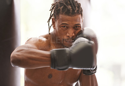 Buy stock photo Power, portrait and black man with boxing gloves in gym for challenge, fight and competition training. Fitness, muscle and serious face of champion boxer at workout with confidence in sports club.