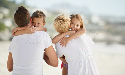 Buy stock photo Smile, beach and children hugging parents with love on travel vacation, holiday or adventure. Happy, care and young kids embracing mother and father by tropical ocean or sea on weekend trip together.