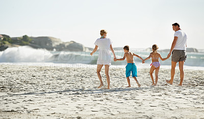 Buy stock photo Parents, children and hand holding on beach for travel together at ocean for trip connection, bonding or love. Man, woman and siblings with back view at sea in Florida for vacation, outdoor or family