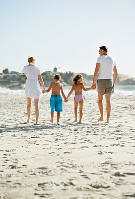 Buy stock photo Parents, children and hand holding on beach for holiday together at ocean for connection, bonding or travel. Man, woman and siblings with back view at sea in Florida for vacation, outdoor or journey