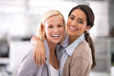 Buy stock photo Cropped portrait of two businesswomen standing in the office