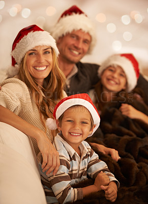 Buy stock photo Christmas, portrait and happy family on a sofa at a party, celebration or event for the holidays. Happiness, love and parents sitting with their children in the living room of their home on xmas.