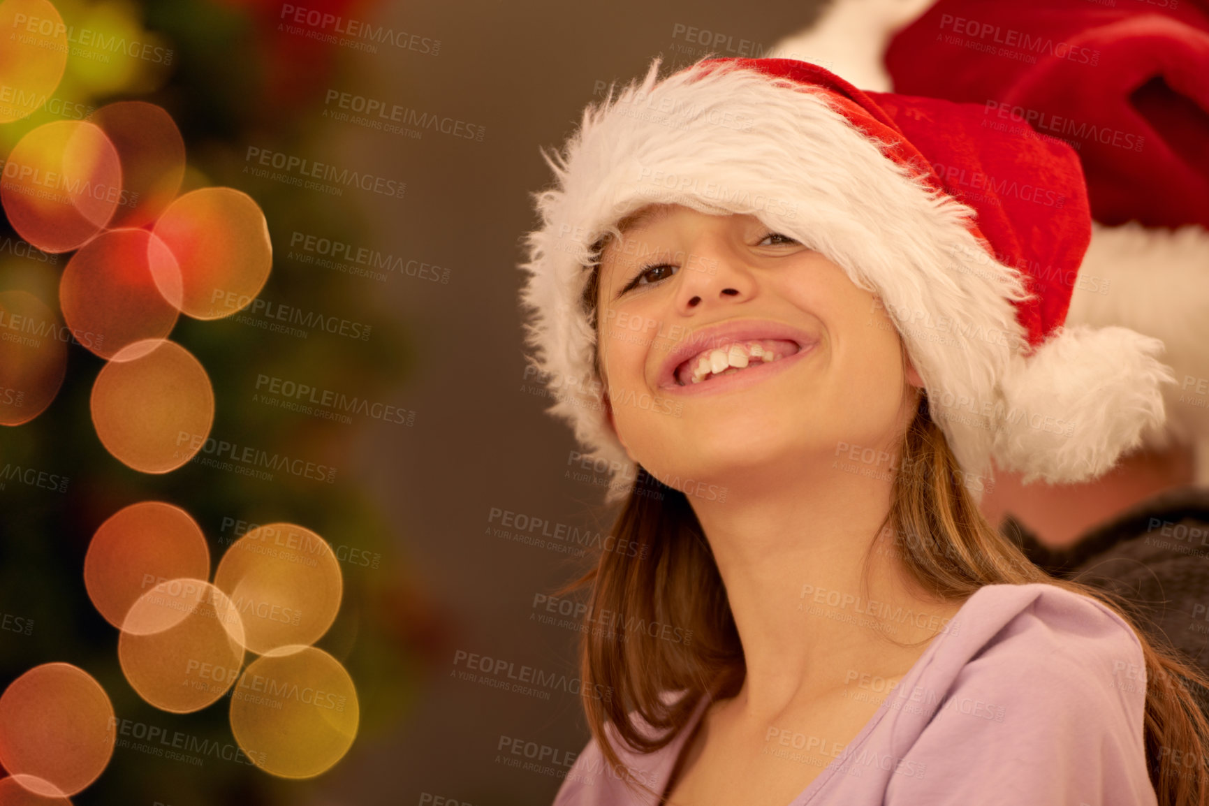 Buy stock photo Portrait, child and christmas in a santa hat to celebrate the festive season with childhood joy and happiness. Holiday, xmas and little girl or kid smiling while celebrating a tradition in december