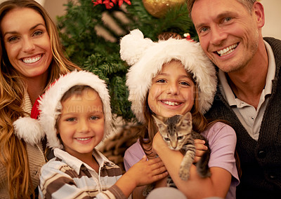 Buy stock photo Christmas, kitten and portrait of a happy family in their home for festive party, event or celebration. Happiness, smile and parents giving children cat for xmas present or gift to celebrate holidays
