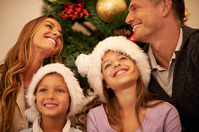 Buy stock photo Christmas, family and happiness of children and parents together to celebrate holiday with love, smile and care. Face of man, woman or father, mother and kids in house for xmas celebration fun