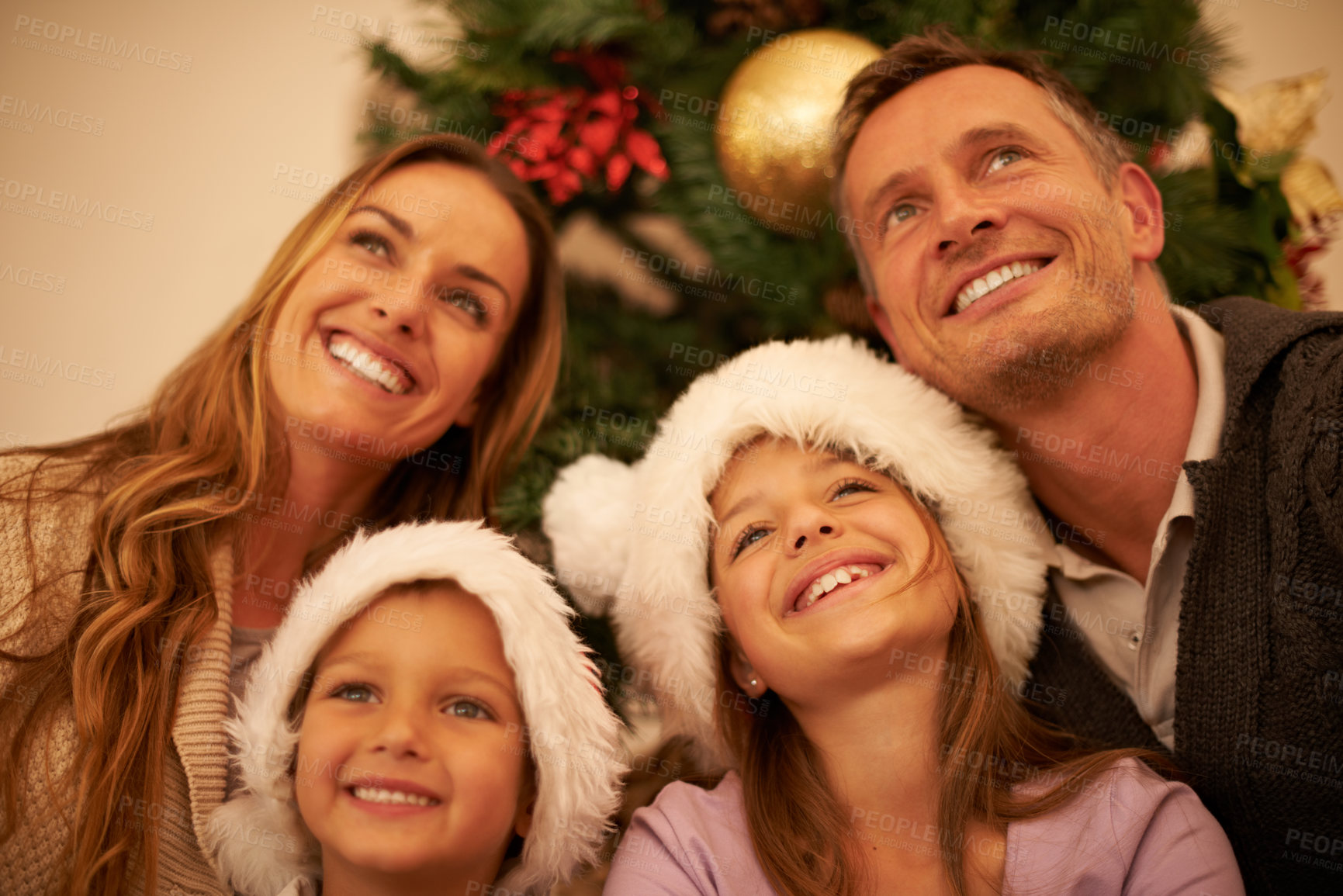 Buy stock photo happy family love, Christmas celebration and face of mother, father and children bond together on festive holiday. Happiness, wow and relax mom, dad and youth kids looking up during fun global event