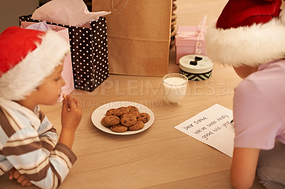 Buy stock photo Kids writing letter to santa for christmas, presents and gifts for good behavior in home, house and festive holidays. Boy, girl and young children write paper note, milk and cookies for santa claus 