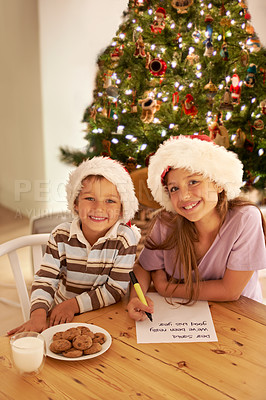 Buy stock photo Kids, portrait and christmas cookies note for festive celebration with young siblings in home. Happy, children and writing letter for santa with excited smile, milk and baked cookie recipe.
