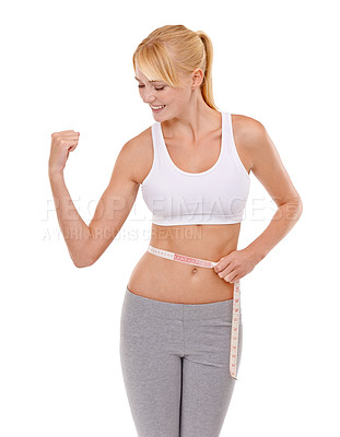 Buy stock photo Woman, stomach and tape in studio for health, measuring and fitness for weight loss. Female person, excited on progress and success for slim body, abdomen and workout isolated with white background