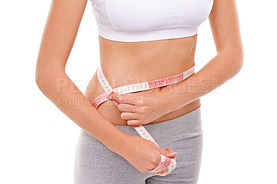 Buy stock photo Woman, stomach and measure in studio for health, fitness and track for weight loss. Female person, results on progress and nutrition for slim body, abdomen and workout isolated with white background