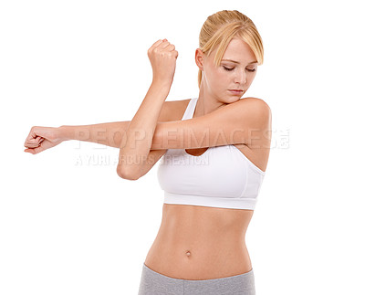 Buy stock photo Woman, arm and stretching in studio for yoga exercise with flexibility health, performance or wellness. Female person, face and pilates on white background or warm up practice, muscle or mockup space