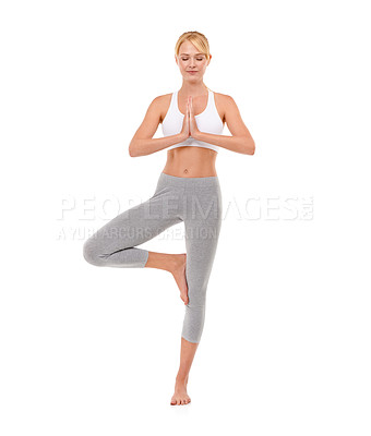 Buy stock photo Full-length shot of an attractive young woman meditating while doing yoga