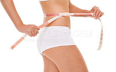 Buy stock photo Woman, wellness and weight loss for health, fitness and studio for workout and body care with tape measure. Female person, stomach and white background for diet, exercise and natural in underwear 