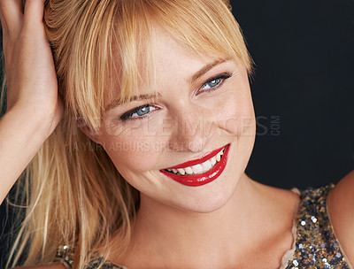 Buy stock photo Closeup, woman and red lipstick with smile for beauty, glamour and makeup on black background. Confident female person, lips and classy cosmetics with glow, happiness and elegance on mockup in studio