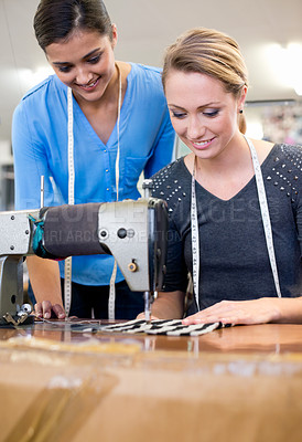 Buy stock photo Designers, collaboration and sewing for planning on fashion, coworkers and tailor on fabric. Women, teamwork and support on textile in clothing business, manufacturing and partnership on style