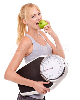 Buy stock photo Portrait, scale and woman with apple for progress, diet benefits or food to lose weight in studio. Healthy eating, nutrition and happy girl with fruit for weightloss, digestion and white background