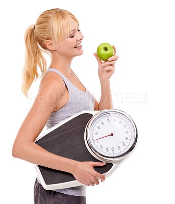 Buy stock photo Scale, smile and woman with apple for diet, benefits or food to lose weight in studio. Healthy eating, nutrition and happy with girl with fruit for body wellness, weightloss and white background