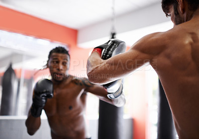 Buy stock photo Man, boxing and personal trainer for workout practice in combat gym for competition endurance, performance or progress. Male person, coach and pad with gloves for fighting challenge, battle or cardio