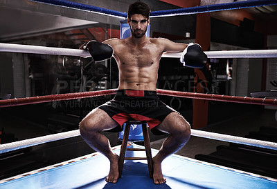 Buy stock photo Man, portrait and boxer in ring for confidence, challenge and fighting match or competition. Male person, boxing gloves and shirtless in arena for training, fitness and athlete for sitting in chair