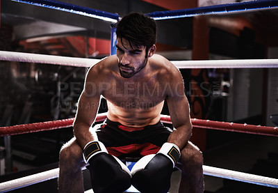 Buy stock photo MMA, boxer and man sitting in ring ready for challenge, competitive and confident from training in gym. Male person, healthy and fitness from practice in exercise studio as athlete  and fighter