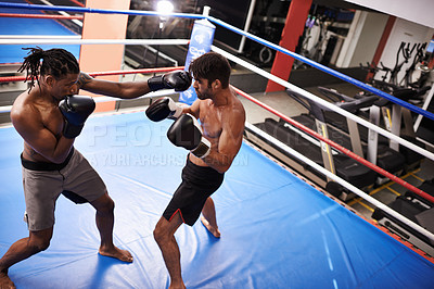 Buy stock photo Men, fighting and boxing ring for fitness competition in gym for endurance development, performance or training. Male people, punch and combat sport together for cardio battle,  defense or practice