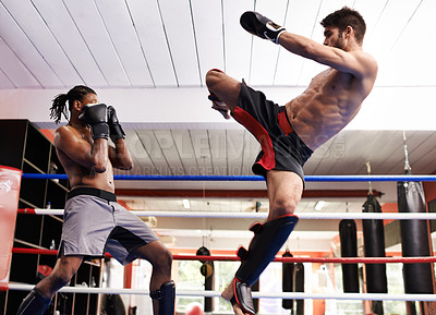 Buy stock photo Fighter, kickboxing and training with opponent in ring for challenge, competitive and athlete for strength in gym. Man, healthy and fitness from practice in exercise studio for sport or action of MMA