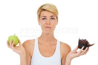 Buy stock photo Woman, fitness and health for food doubt, nutrition and decision by studio for lifestyle. Female person, athlete and portrait for diet, workout and white background with apple and cake choice
