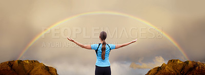 Buy stock photo A woman standing with her arms outstretched in front of a rainbow