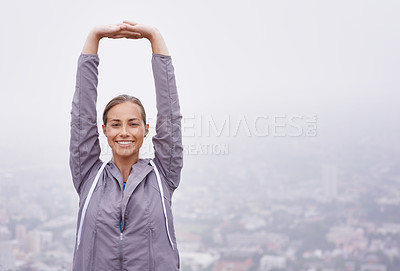 Buy stock photo Portrait, woman and stretching with smile for exercise, health and wellness on cloudy day in France. Happy, female person and sportswear with fitness, workout and warm up for self care with mockup