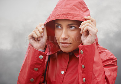 Buy stock photo Woman, rain jacket and hood with weather for cloudy sky, winter season or outdoor storm. Face of female person with red waterproof coat and looking up at rainy overcast for cold, protection or fog