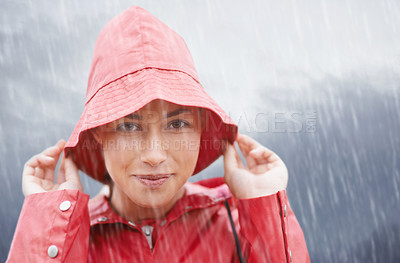 Buy stock photo Woman, smile and portrait with rain, coat and clouds with happiness in nature. Person, face and storm with cloudy, winter and waterproof hat for protection and confidence with safety or adventure