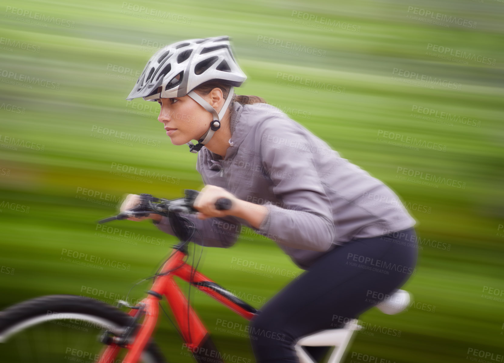 Buy stock photo Woman, bike and nature with ride, speed and fitness for health and wellness or workout. Athlete, cycling and exercise for training, transportation and adventure with helmet for cardio and motion blur