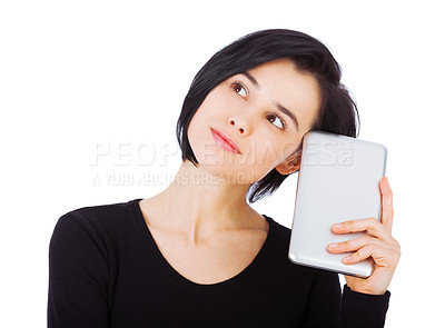 Buy stock photo Cropped shot of an attractive young woman using her digital tablet against a white background
